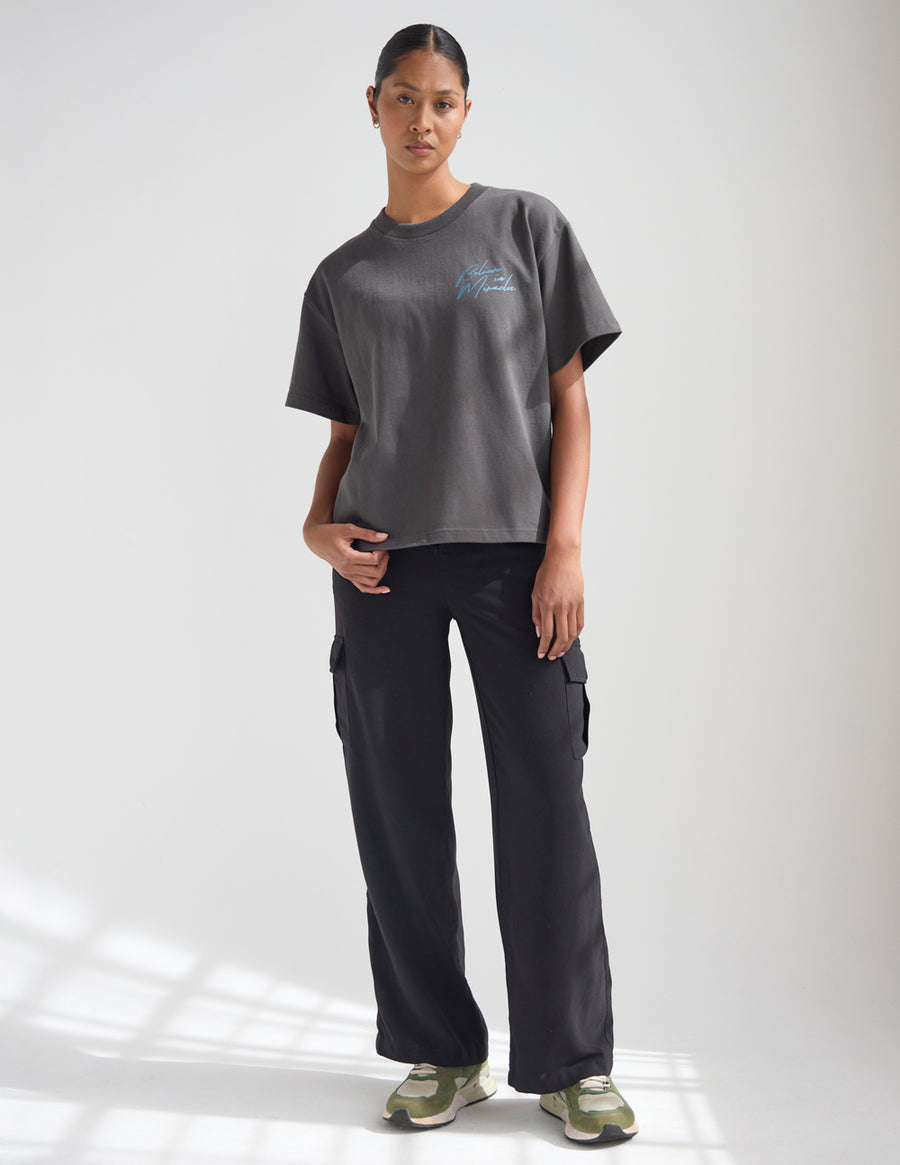 Dark Coastal Graphic Tee — "Follow the Moonlight" Surfer Silhouette T-Shirt